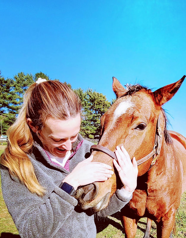 Cindy Cisneros, therapist, certified HEAL equine psychotherapist with bay mare | Eldersburg Equine Psychotherapy, therapy with horses in Eldersburg, Maryland for anxiety, depression trauma, ADHD, neurodiversity, and more